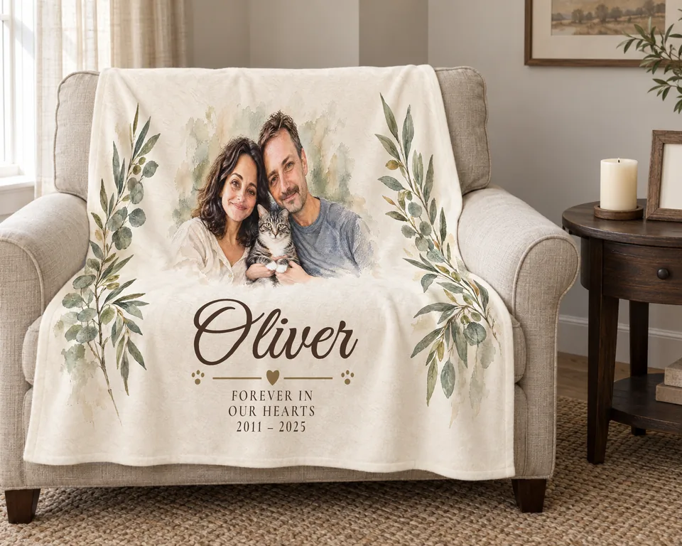 Oliver’s memorial blanket on an armchair, with his family portrait, name, and years.