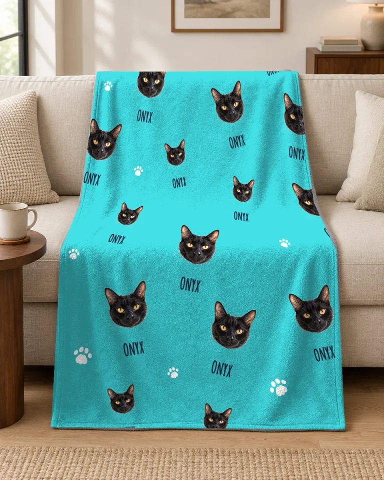 A personalized cat face blanket draped over a sofa.