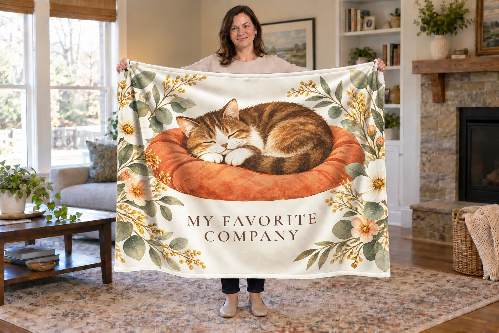 Person holding a cream blanket with a sleeping brown-and-white tabby in watercolor and My Favorite Company.