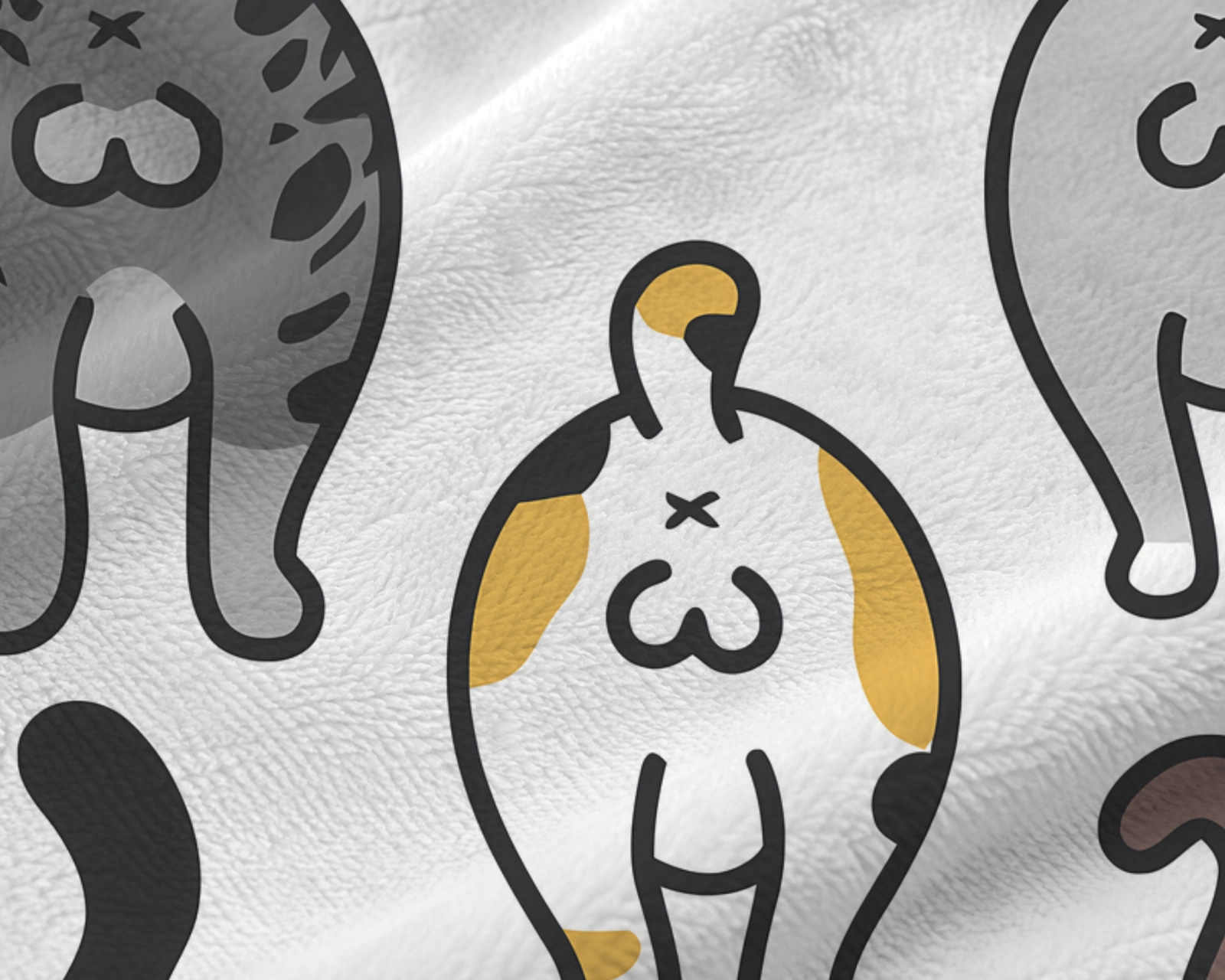 Close-up of the cat butt blanket pattern showing crisp printed cats on soft short-pile flannel texture.