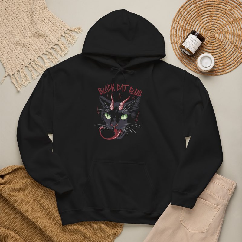 Close view of a horned black cat with green eyes, a curling red tongue and angular red lettering in the front print