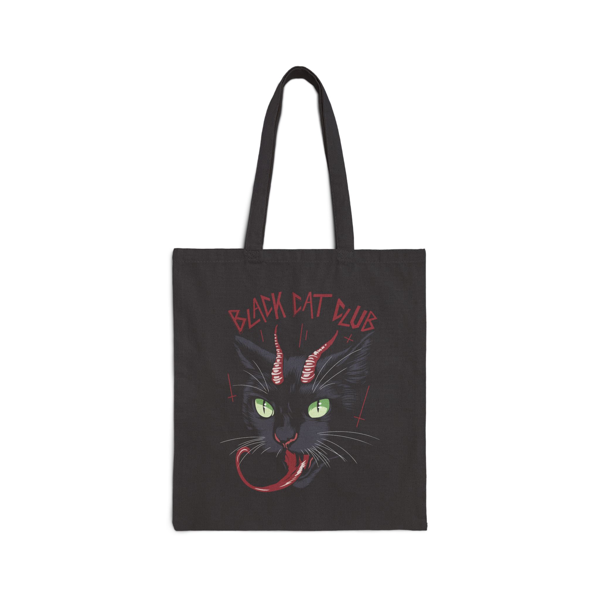 Front of the black canvas tote showing a horned black cat with green eyes, a curling red tongue and angular red lettering