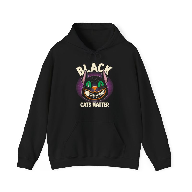 Front of the hoodie showing a grinning black cat with huge green eyes, orange mouth outlines and a purple halo