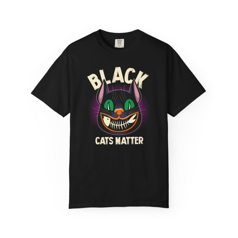 Front of the tee showing a grinning black cat with huge green eyes, orange mouth outlines and a purple halo