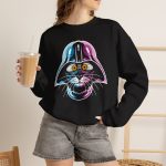 Person wearing a crewneck sweatshirt showing an amber-eyed cat in a dark sci-fi helmet with cyan, magenta and white highlights