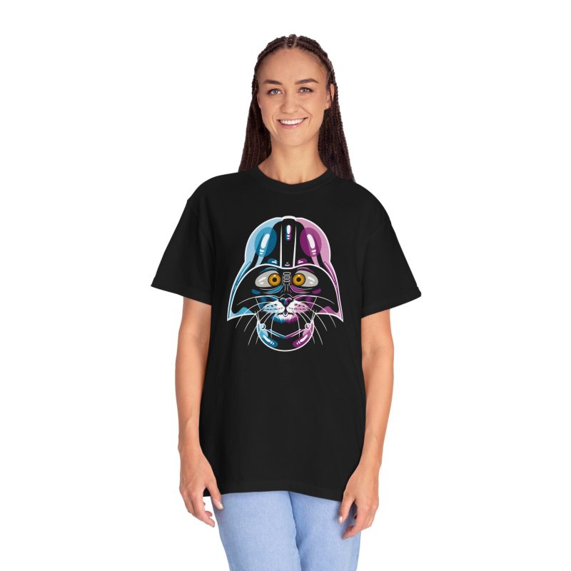 Person wearing a tee showing an amber-eyed cat in a dark sci-fi helmet with cyan, magenta and white highlights