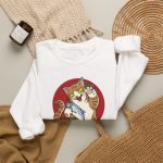 Close view of a giant brown tabby holding a blue fish above waves in front of a red sun disc in the front print