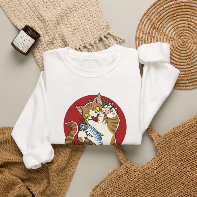 Close view of a giant brown tabby holding a blue fish above waves in front of a red sun disc in the front print