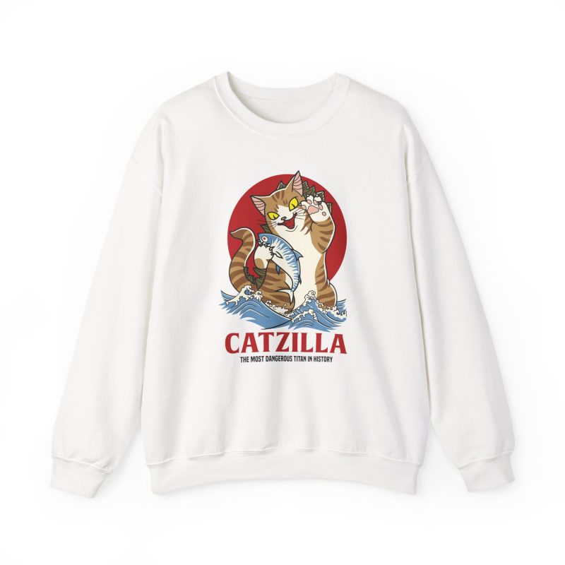 Front of the crewneck sweatshirt showing a giant brown tabby holding a blue fish above waves in front of a red sun disc