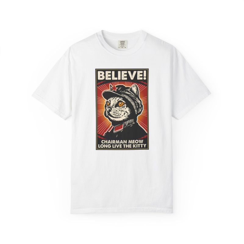 Front of the tee showing a stern black-and-cream cat in a red-star cap with orange-red sunburst rays and a black frame