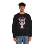 Person wearing a crewneck sweatshirt with a pale pink cat with a unibrow, a flower crown, gold beads and a teal fish printed on the front Person wearing a crewneck sweatshirt with a pale pink cat with a unibrow, a flower crown, gold beads and a teal fish printed on the front