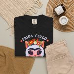 A pale pink cat with a unibrow, a flower crown, gold beads and a teal fish in the front print