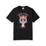 Front of the tee showing a pale pink cat with a unibrow, a flower crown, gold beads and a teal fish