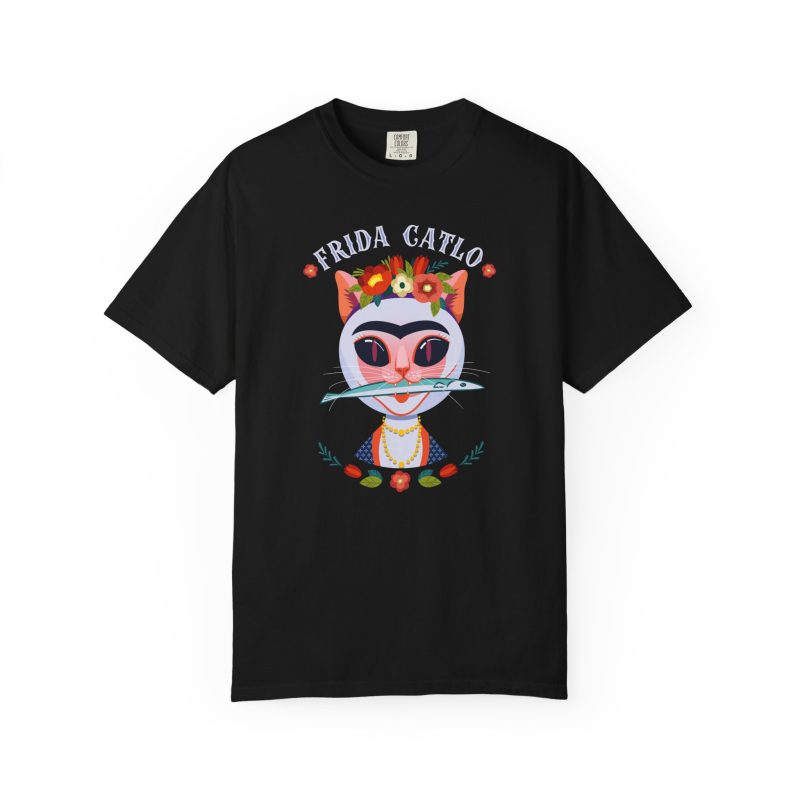 Front of the tee showing a pale pink cat with a unibrow, a flower crown, gold beads and a teal fish