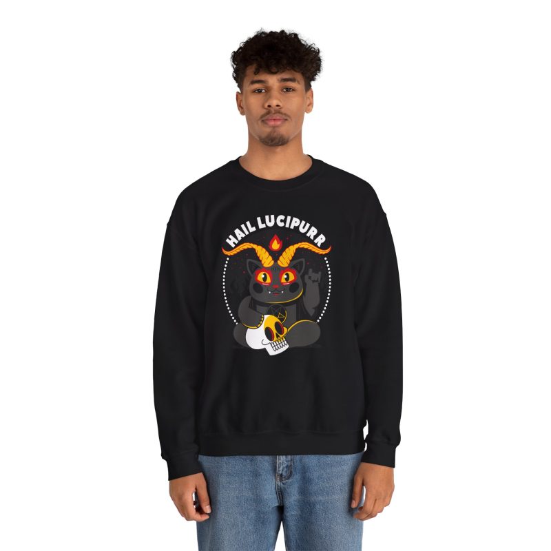 Person wearing a crewneck sweatshirt with a dark gray horned cat with yellow eyes, a skull, a pentagram and a flame inside a white dotted circle printed on the front