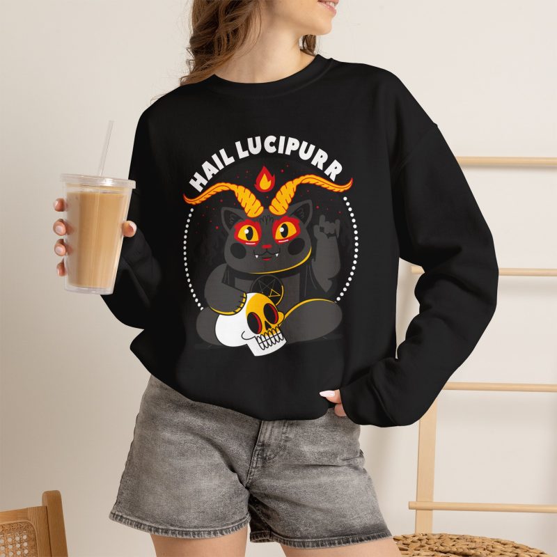 Person wearing a crewneck sweatshirt with a dark gray horned cat with yellow eyes, a skull, a pentagram and a flame inside a white dotted circle printed on the front