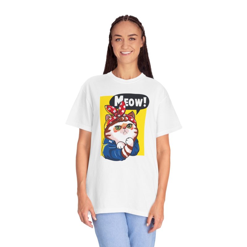 Person wearing a tee with a white and ginger cat flexing its paw in a blue work shirt and red polka-dot bandana on a yellow panel printed on the front