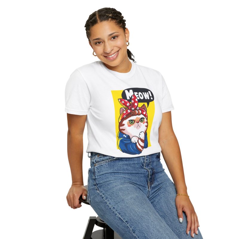 Person wearing a tee with a white and ginger cat flexing its paw in a blue work shirt and red polka-dot bandana on a yellow panel printed on the front