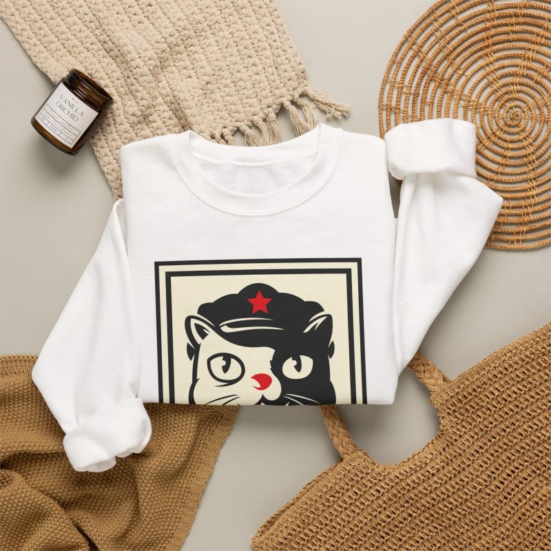 A black and cream cat in a military cap with a red star above a red banner inside a double poster border in the front print