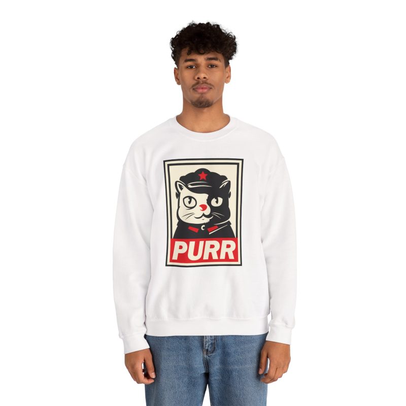 Person wearing a crewneck sweatshirt with a black and cream cat in a military cap with a red star above a red banner inside a double poster border printed on the front