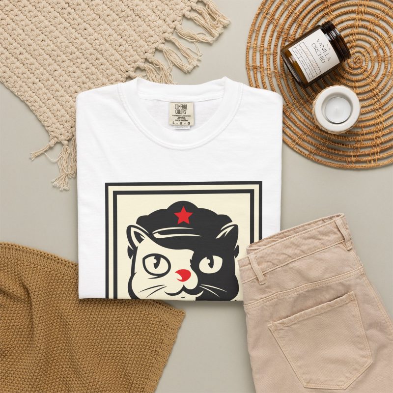 A black and cream cat in a military cap with a red star above a red banner inside a double poster border in the front print