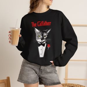 Person wearing a crewneck sweatshirt with a gray cat with green eyes in a white tuxedo shirt and black bow tie with a red rose printed on the front