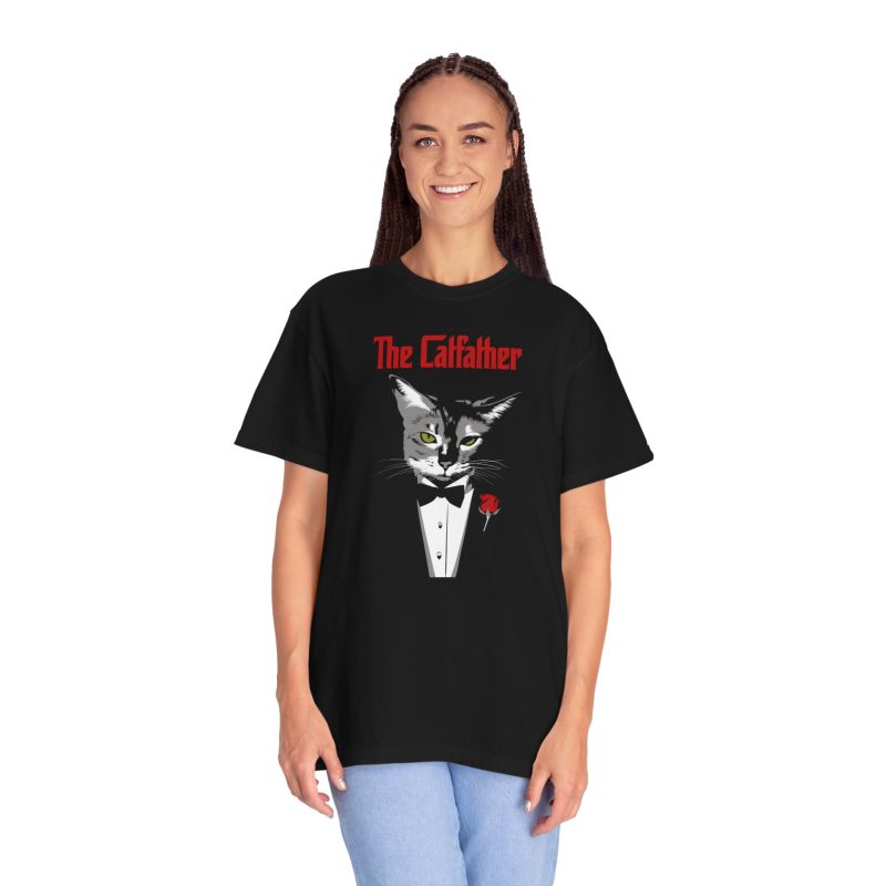 Person wearing a tee with a gray cat with green eyes in a white tuxedo shirt and black bow tie with a red rose printed on the front