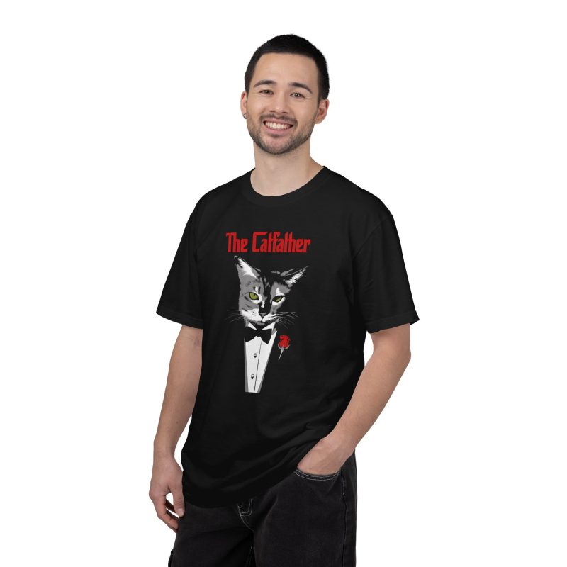 Person wearing a tee with a gray cat with green eyes in a white tuxedo shirt and black bow tie with a red rose printed on the front