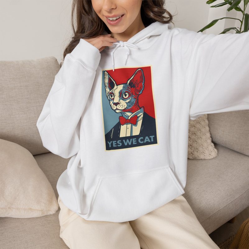 Person wearing a hoodie with a hairless cat in a suit and red bow tie printed on the front