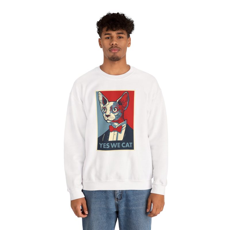 Person wearing a crewneck sweatshirt with a hairless cat in a suit and red bow tie printed on the front