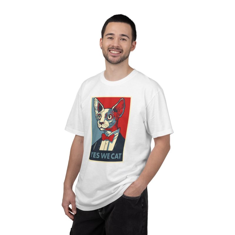 Person wearing a tee with a hairless cat in a suit and red bow tie printed on the front