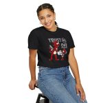 Person wearing a tee with a red cartoon cat and mouse trading a sneaker printed on the front Person wearing a tee with a red cartoon cat and mouse trading a sneaker printed on the front