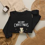 Stacked kittens, paw prints, a starburst and white MEOWY CHRISTMAS lettering in the front print