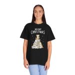 Person wearing a tee with white, gray, cream and ginger kittens stacked into a Christmas tree, surrounded by paw prints beneath white lettering printed on the front