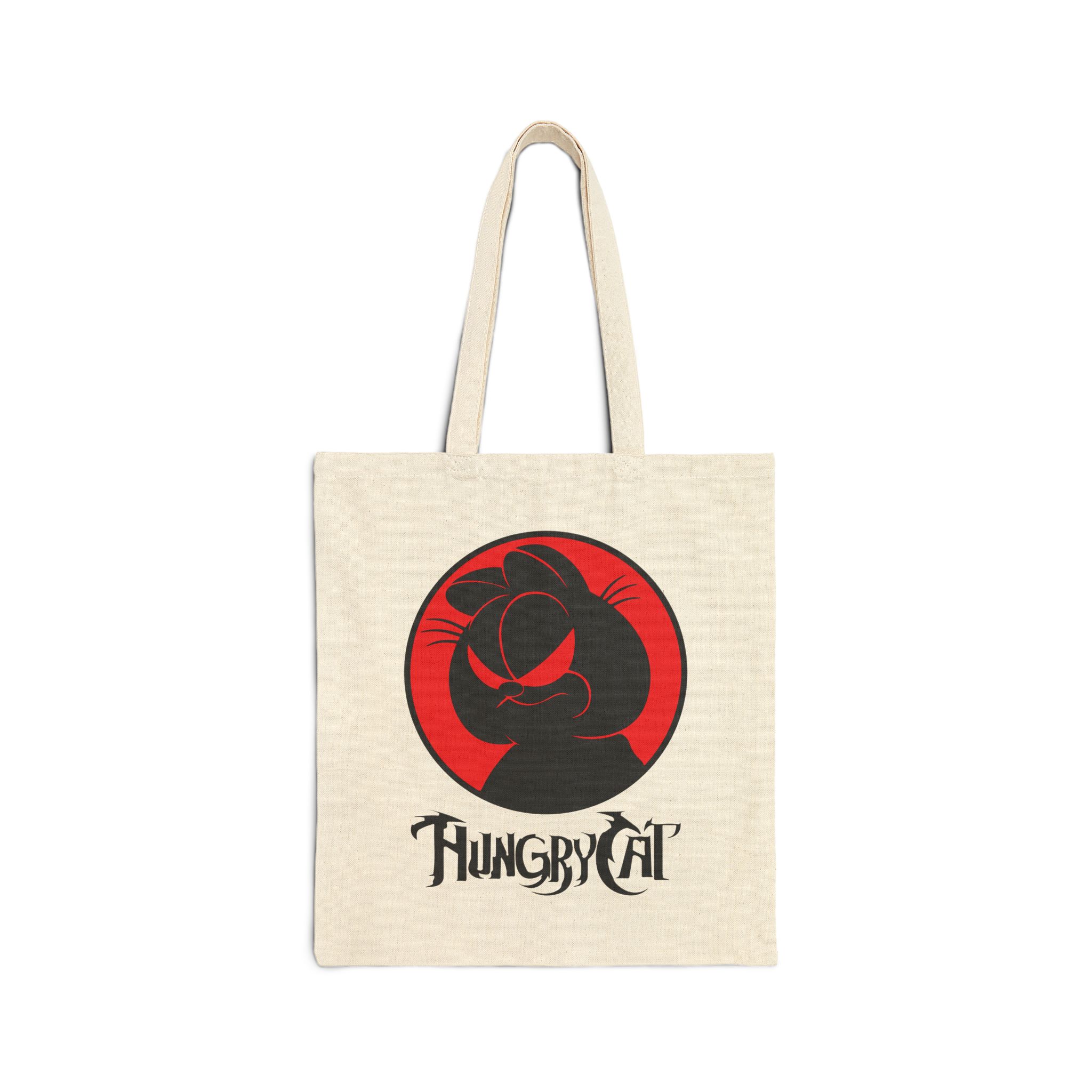 Front of the natural canvas tote showing a sly black cat silhouette inside a red circle