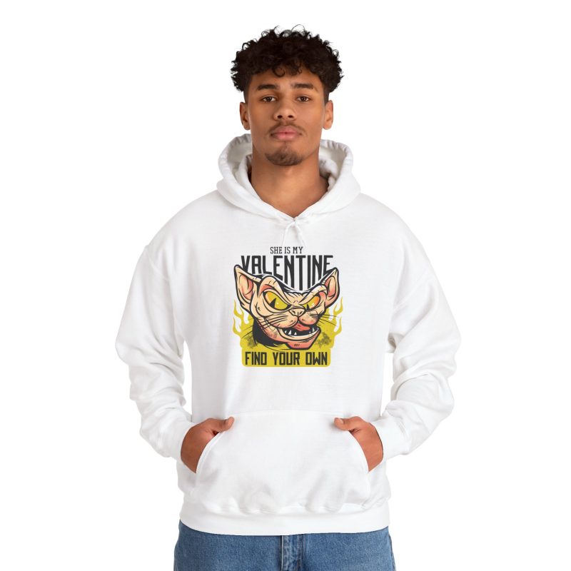 Person wearing a hoodie with a fierce hairless cat with yellow eyes and flames printed on the front