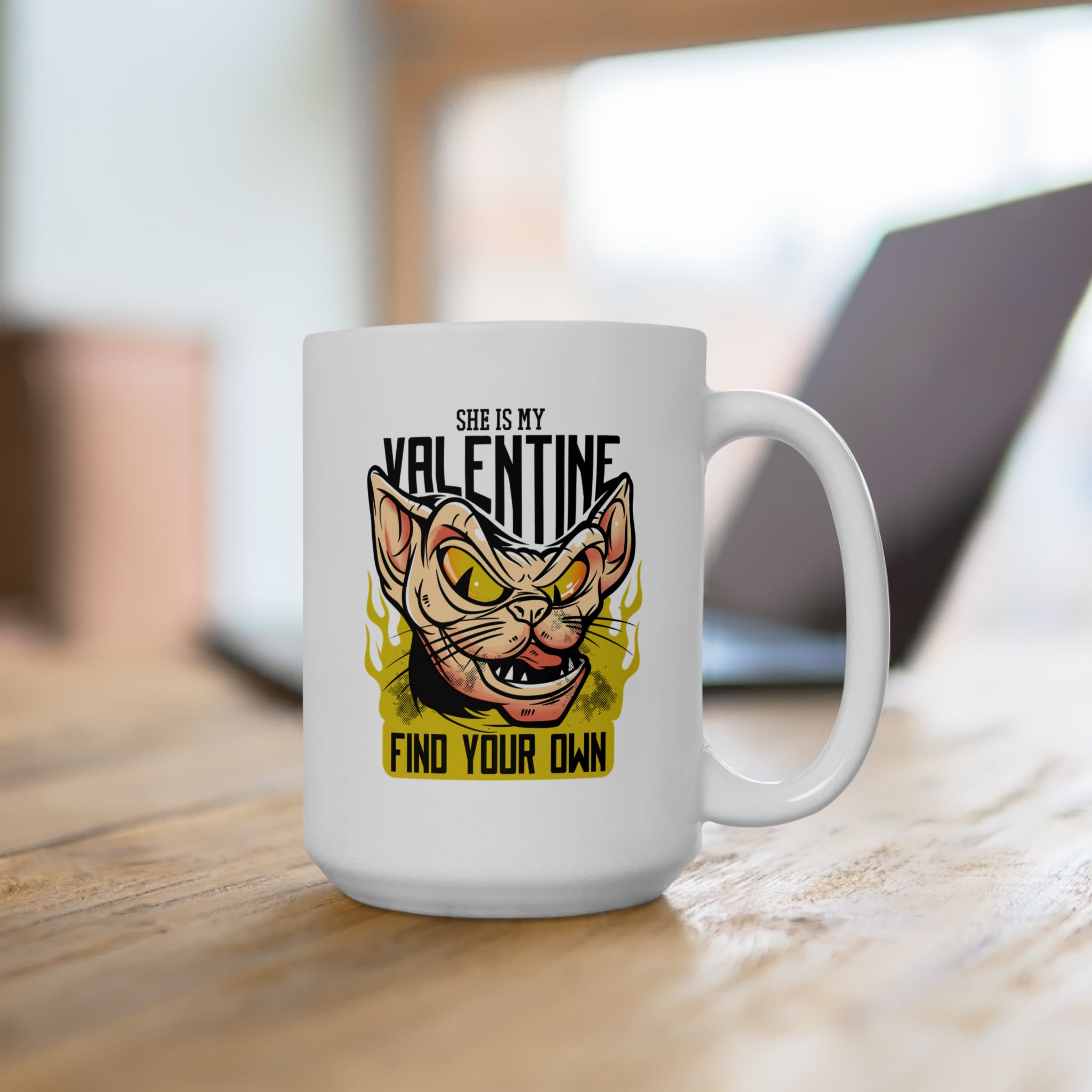 White ceramic mug showing a fierce hairless cat with yellow eyes and flames