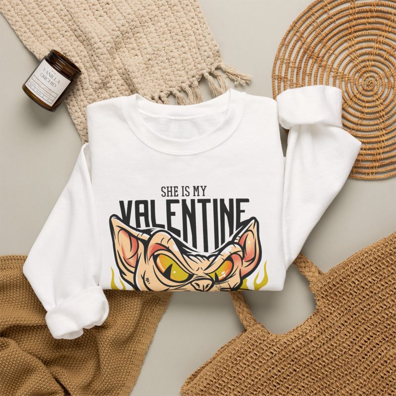 Peach-toned hairless cat baring its teeth amid yellow flames and bold black lettering in the front print