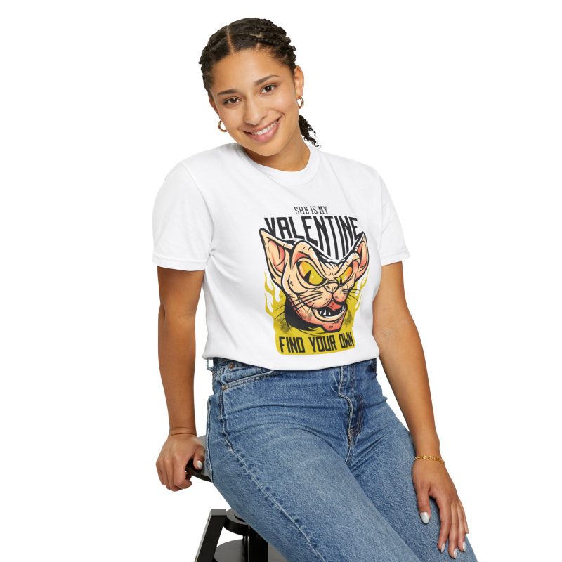 Person wearing a tee with a fierce hairless cat with yellow eyes and flames printed on the front