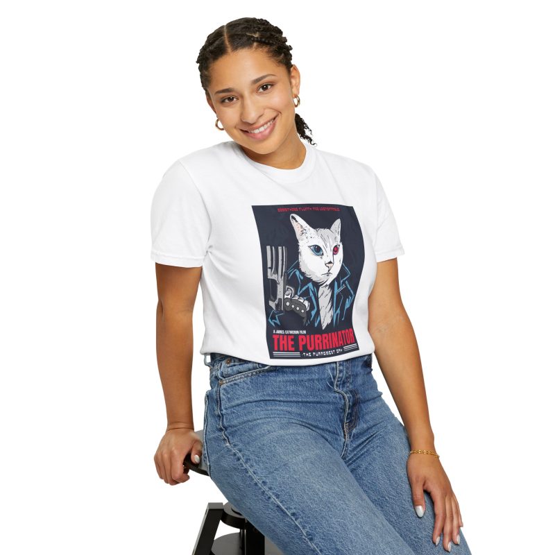 Person wearing a tee with a white cyborg cat with a red eye and leather jacket printed on the front