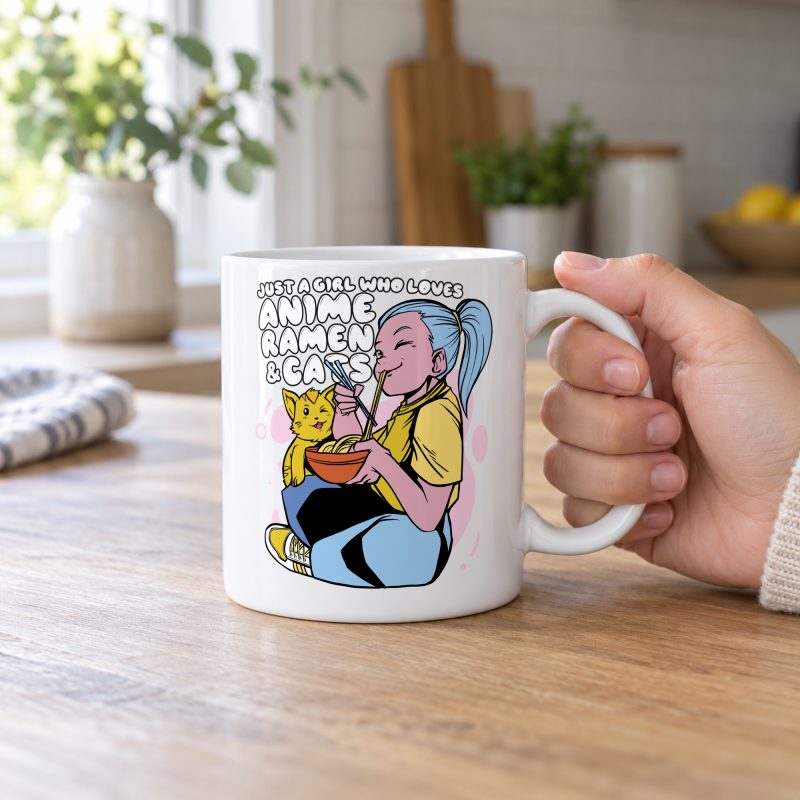 Person holding a white ceramic mug showing a blue-haired girl eating ramen beside a golden ginger cat