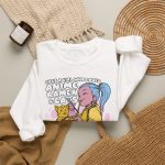 Blue-haired girl eating ramen beside a golden ginger cat and outlined lettering in the front print