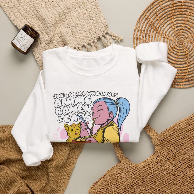 Blue-haired girl eating ramen beside a golden ginger cat and outlined lettering in the front print