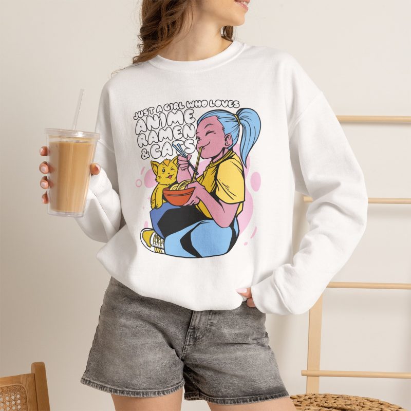 Person wearing a crewneck sweatshirt with a blue-haired girl eating ramen beside a golden ginger cat printed on the front