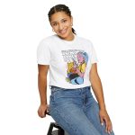 Person wearing a tee with a blue-haired girl eating ramen beside a golden ginger cat printed on the front Person wearing a tee with a blue-haired girl eating ramen beside a golden ginger cat printed on the front