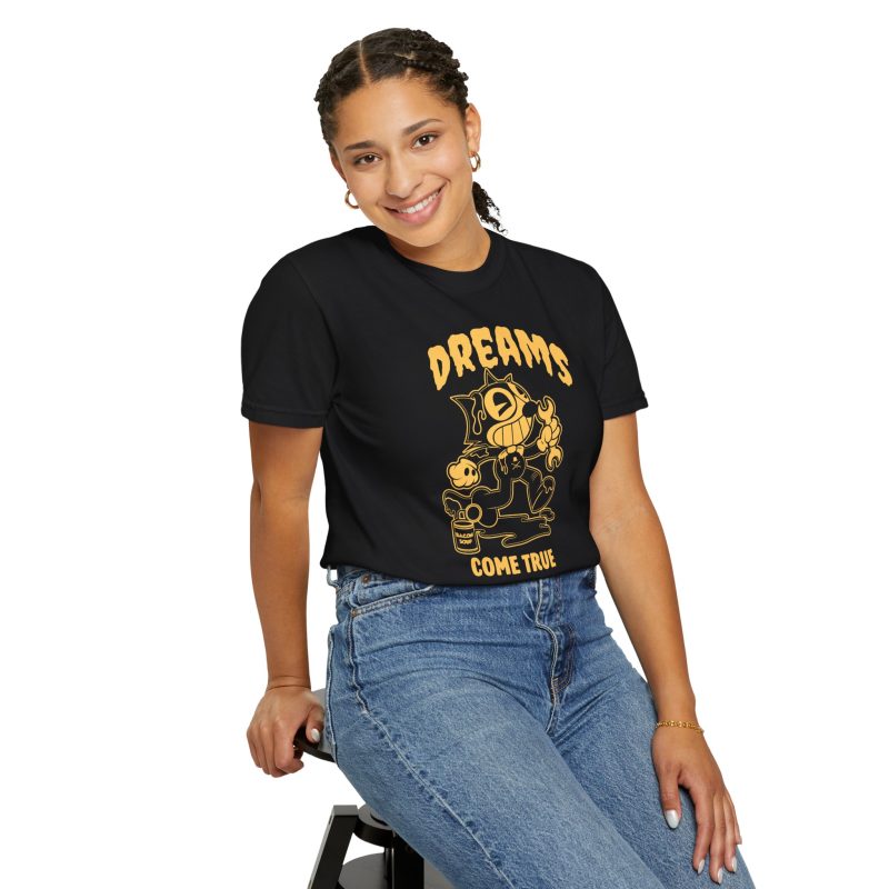 Person wearing a tee with a grinning rubber-hose cartoon cat holding a wrench printed on the front