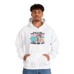Person wearing a hoodie with a ramen-eating girl at a computer with three colorful cats printed on the front Person wearing a hoodie with a ramen-eating girl at a computer with three colorful cats printed on the front
