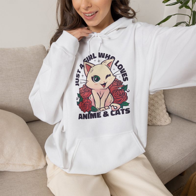 Person wearing a hoodie with a winking pale cream cat framed by red roses and green leaves printed on the front