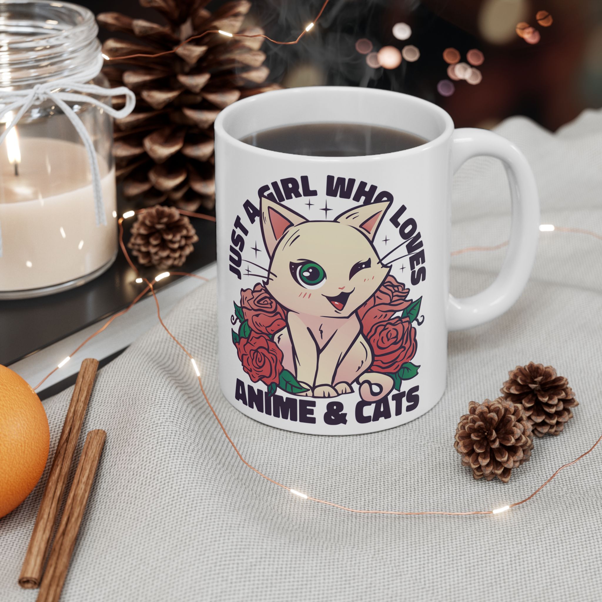 White ceramic mug showing a winking pale cream cat framed by red roses and green leaves