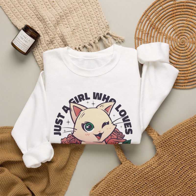 Winking pale cream cat framed by red roses and green leaves and bold lettering in the front print
